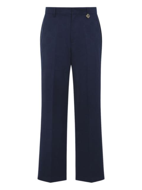 monogram-pattern charm-detail trousers