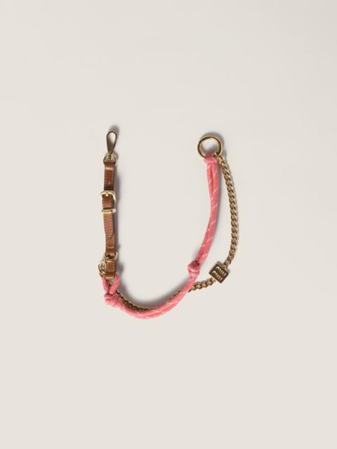 Leather, cord and metal trick