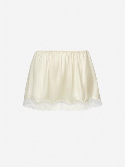 Mini slip skirt with lace-trimmed hem in cream