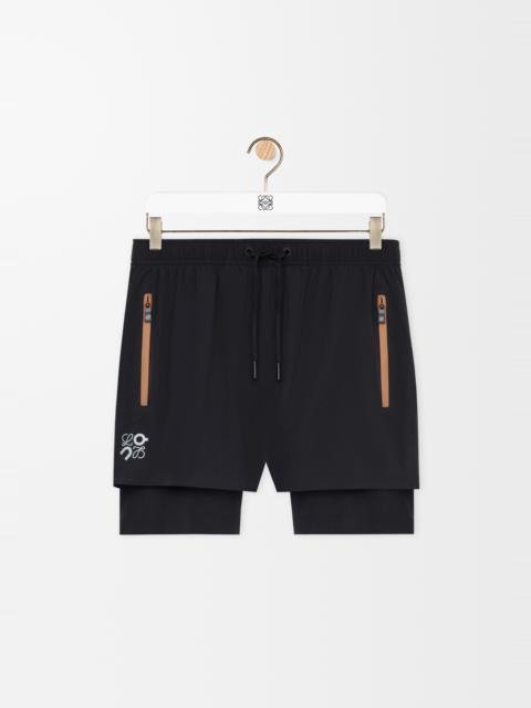 Performance shorts in technical shell