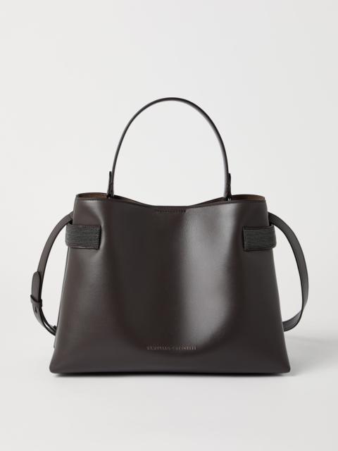 Essence top-handle bag in calfskin with precious bands