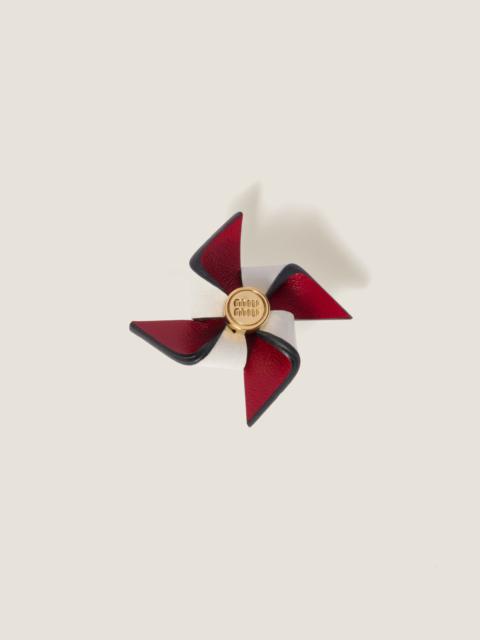 Leather pinwheel brooch