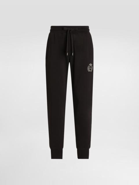 Jersey trousers with heraldic patch