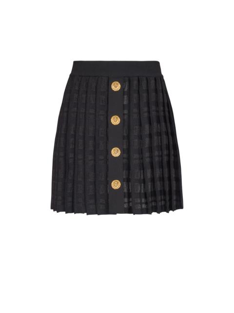Short pleated skirt in plaid knit
