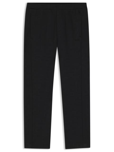 QUILTED-JACQUARD TRACKSUIT BOTTOMS IN A REGULAR FIT