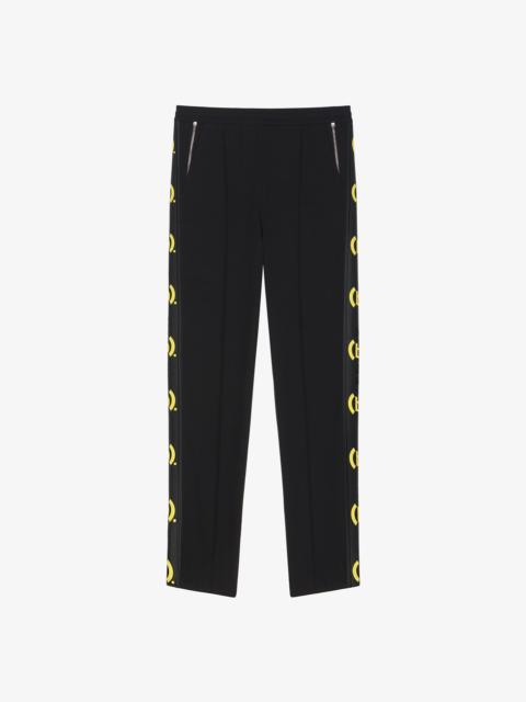 SLIM-FIT JOGGER PANTS IN JERSEY WITH (B). PRINTED GIVENCHY BANDS