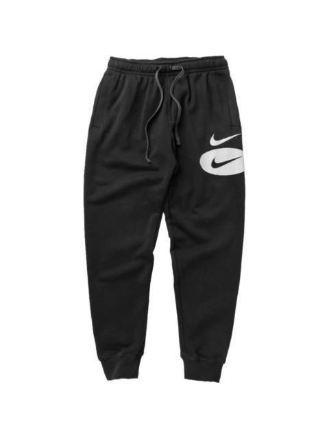 swoosh league trousers