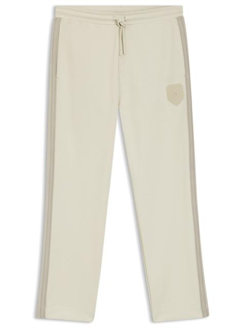 CREST-LOGO TRACKSUIT BOTTOMS IN A REGULAR FIT