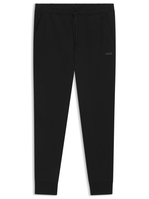 STRETCH-COTTON TRACKSUIT BOTTOMS WITH LOGO PRINT