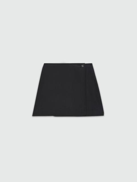 Black cady miniskirt with "TheMwave" detail