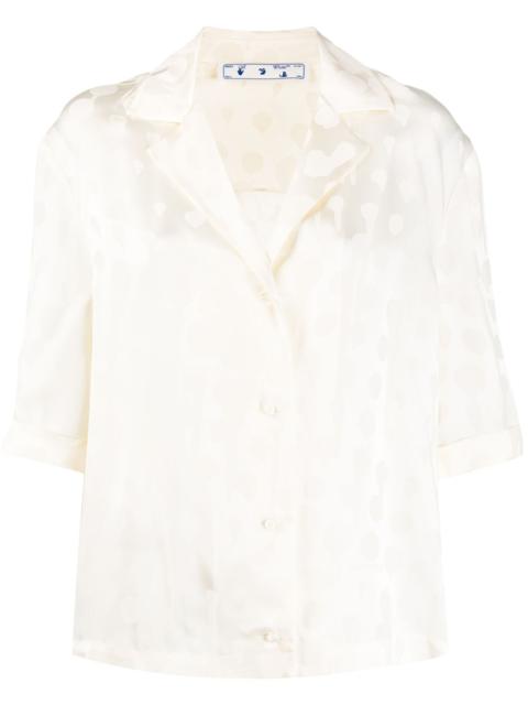 splatter-effect polka dot top