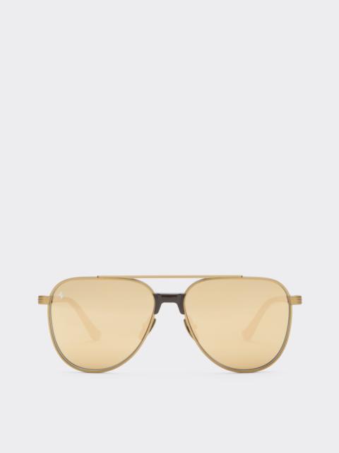 Ferrari sunglasses in matte gold titanium and acetate with transparent yellow-gold mirrored lenses