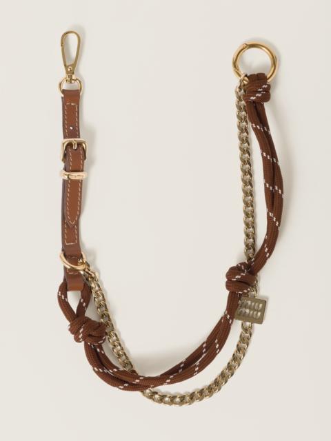 Leather, cord and metal trick