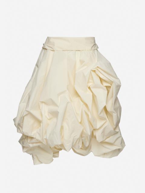 Draped skirt with sculptural volume in cream
