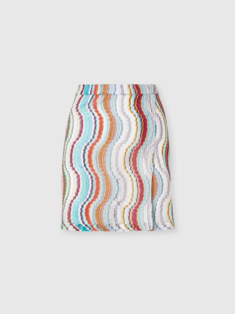Cover-up miniskirt with lamé wave motif and slit