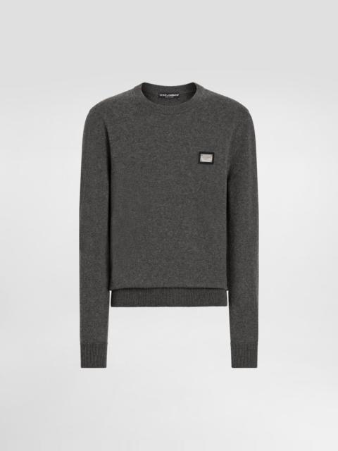 Wool round-neck sweater with branded tag