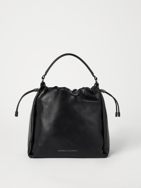 Mellow bucket bag in soft leather with monili