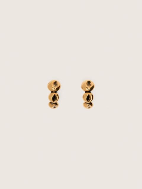 Hoop earrings with antique gold-colored studs