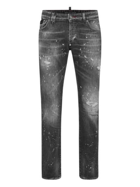 distressed paint-splattered jeans