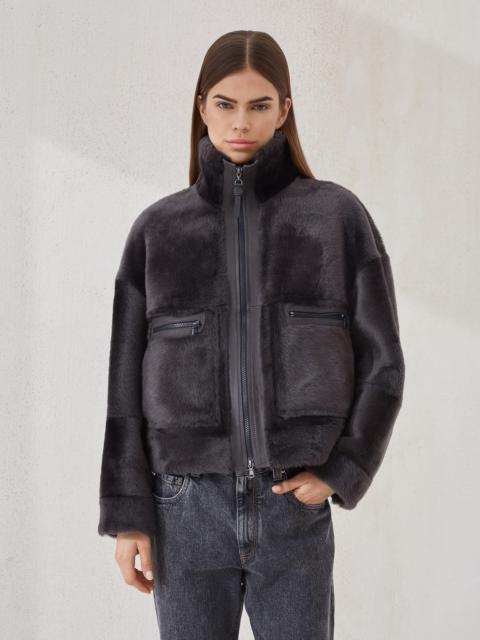 Shearling outerwear jacket with shiny zipper pull