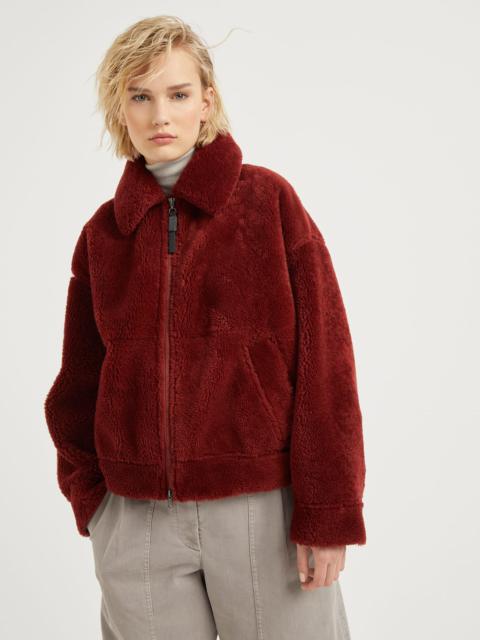 Curly shearling outerwear jacket with shiny zipper pull