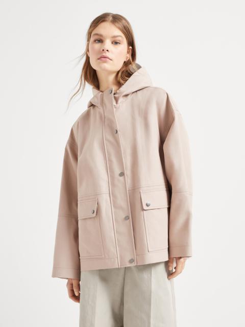 Water-resistant bonded cotton poplin outerwear jacket with heat-bonded seams and shiny zipper pull