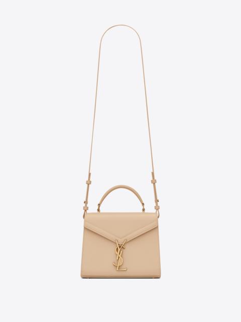cassandra mini top handle bag in grain de poudre embossed leather