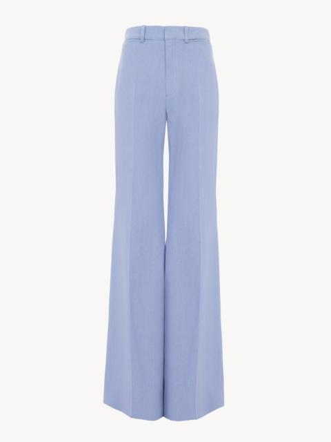 HIGH-RISE FLARED PANTS IN LINEN CRÊPE