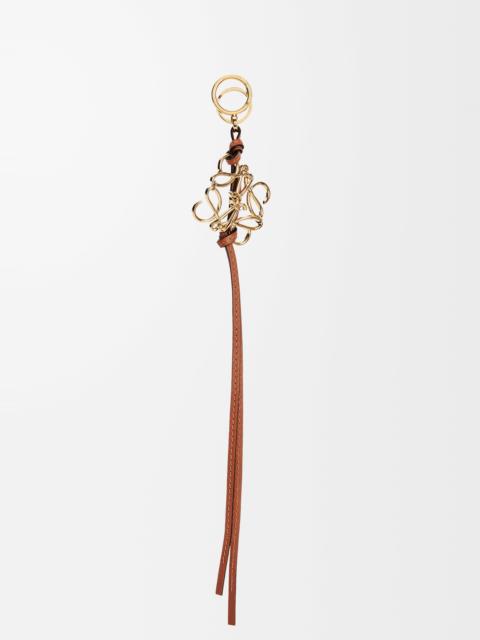 Anagram charm in metal and calfskin