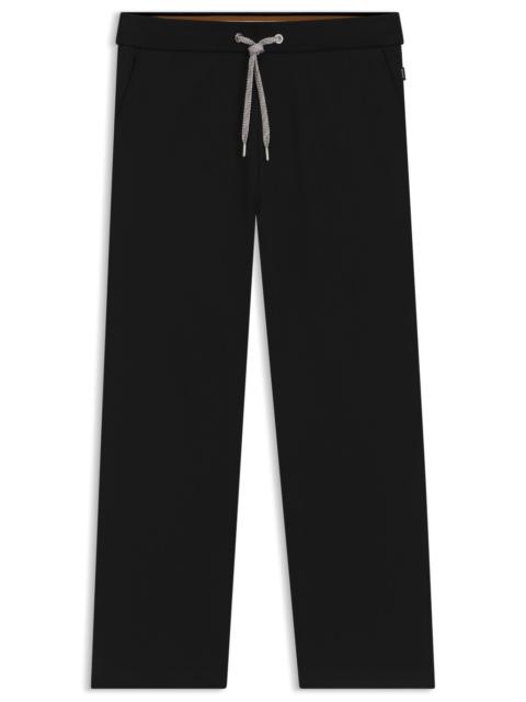 TRACKSUIT BOTTOMS WITH PATTERNED DRAWCORD