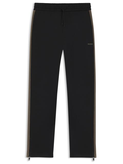 RELAXED-FIT TRACKSUIT BOTTOMS WITH LOGO TAPE