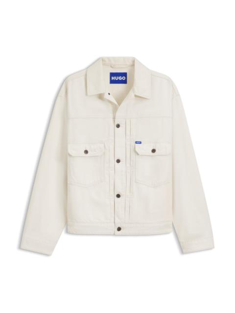 RELAXED-FIT TRUCKER JACKET IN ECRU DENIM