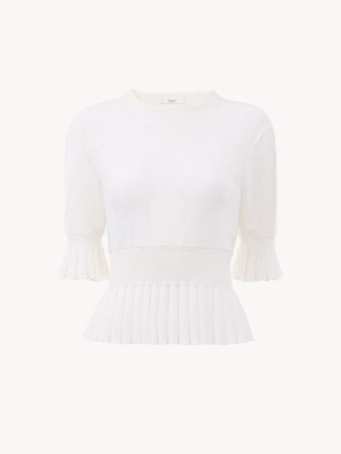 CROPPED RUFFLE SWEATER IN A WOOL KNIT