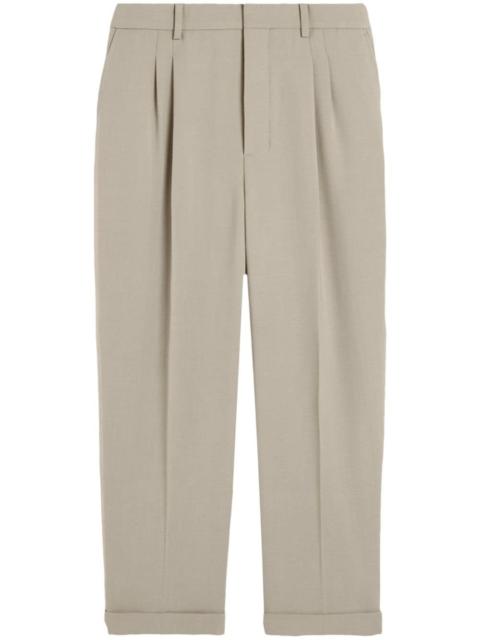 pressed-crease pleated tapered trousers