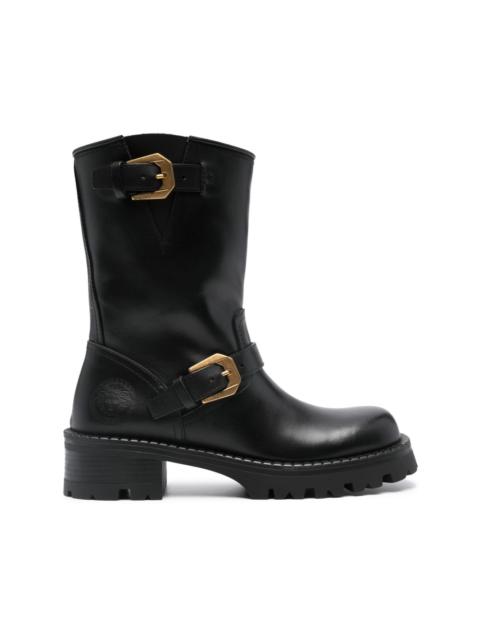 Medusa-embossed leather boots