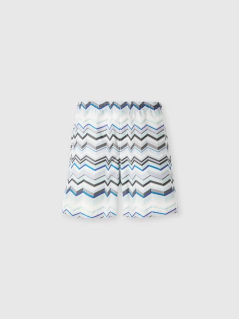 Long swim shorts with irregular zigzag print