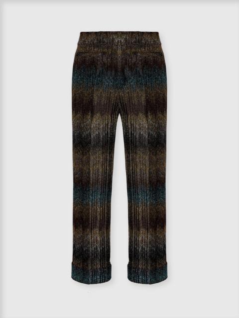 Flared trousers in viscose lamé snake motif