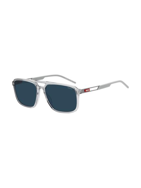 RUBBER-LOGO SUNGLASSES IN CLEAR ACETATE