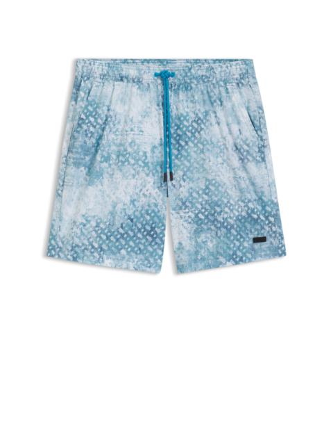 MONOGRAM-ARTWORK SWIM SHORTS WITH LOGO BADGE