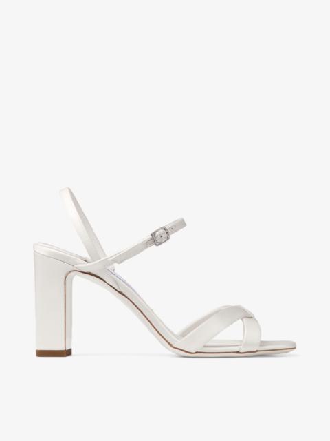 Elsy Block Heel 85
Ivory Satin Sandals with Crystal-Embellished Buckle