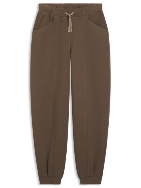RELAXED-FIT TRACKSUIT BOTTOMS WITH LUSTROUS PIPING