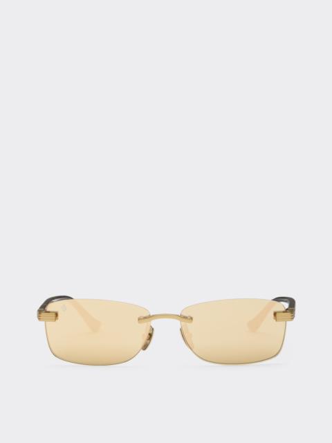 Ferrari sunglasses in matte gold titanium and acetate with transparent gold mirrored lenses
