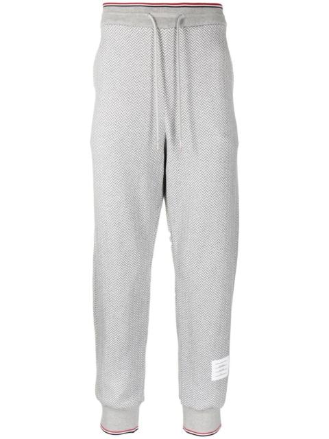 herringbone-pattern logo-patch track pants