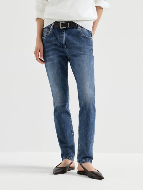 Stretch denim slim five-pocket trousers with shiny leather tab