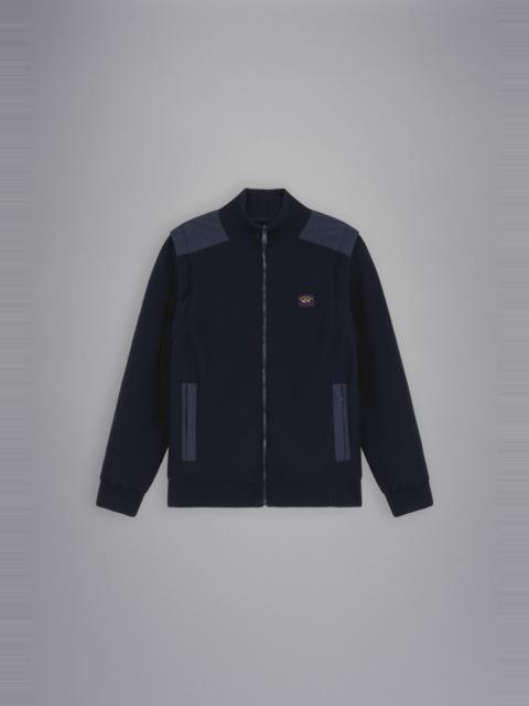 REVERSIBLE JACKET WITH DETACHABLE SLEEVES