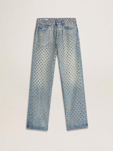 Women's washed jeans with all-over eyelets