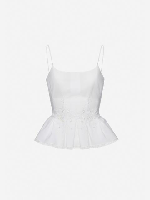 Embroidered peplum top in white