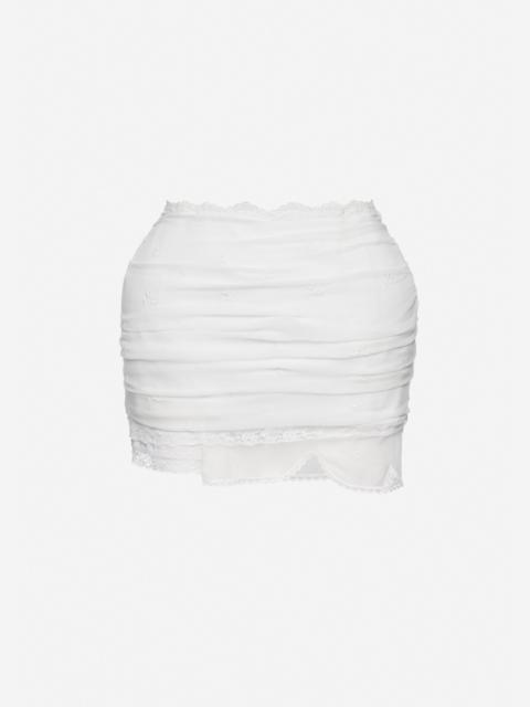 Draped mini skirt with lace trim in white