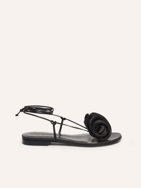 Wrap around flat flower sandals in black satin