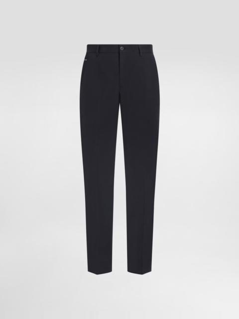 Stretch cotton pants with branded tag